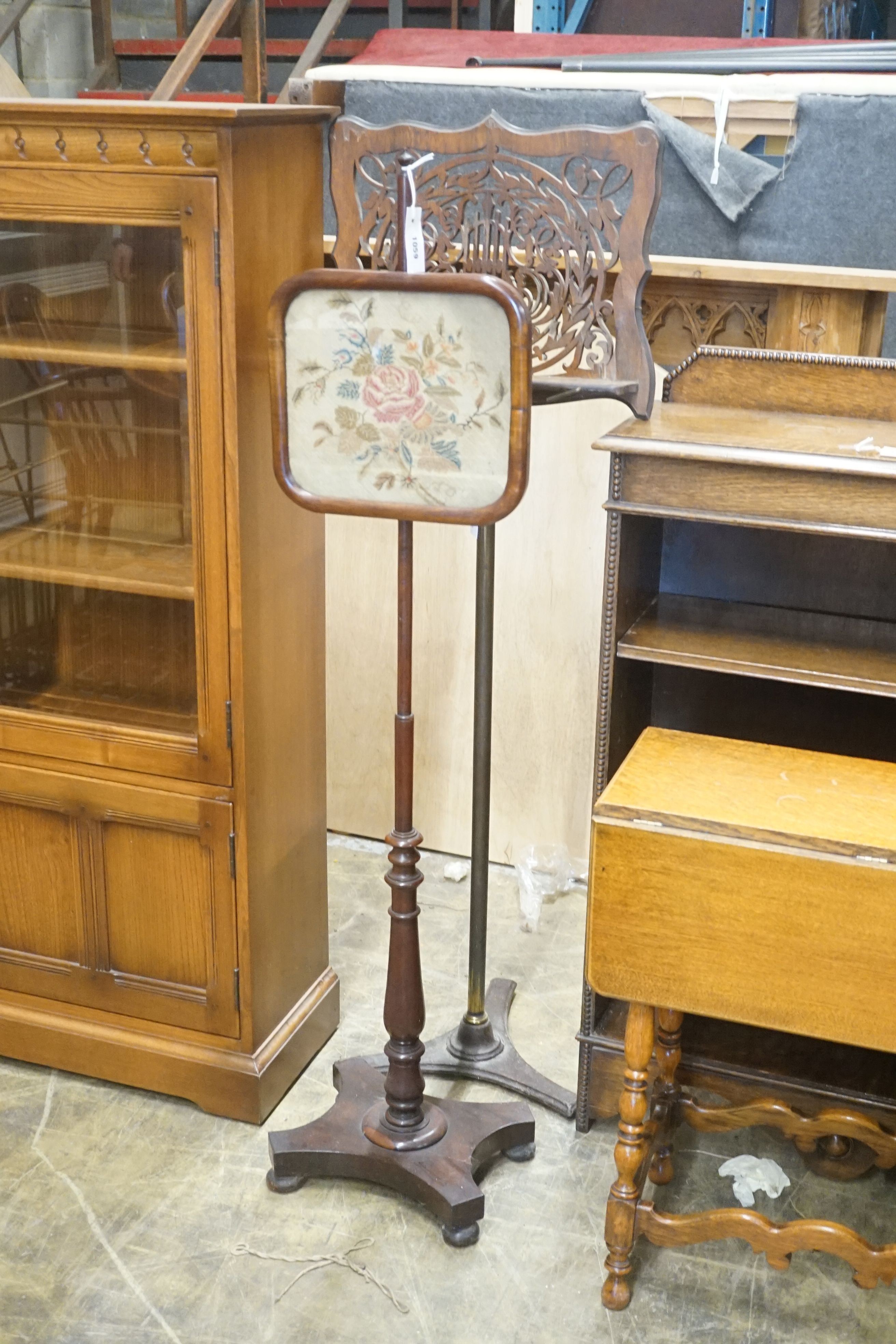 A Victorian rosewood pole screen and a fret cut music stand